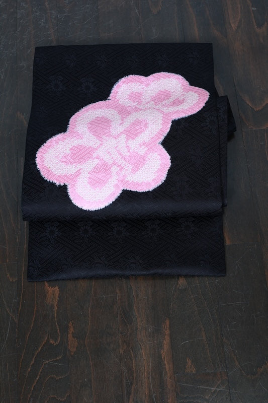 Nagoya obi (used sash), Arimatsu Shibori (tie-dyeing), black with cherry blossom pink accents, Hat Shibori (tie-dyeing), Hikida Shibori (tie-dyeing), Sayagata floral pattern throughout, R104