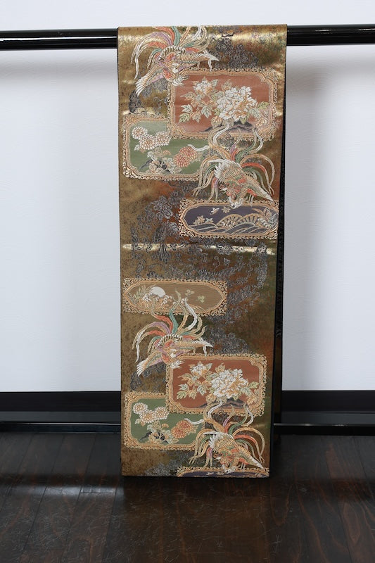 New, unstitched fukuro obi (formal sash). Gold, purple, black, and white. Features phoenixes, butterflies, and flowers. R231