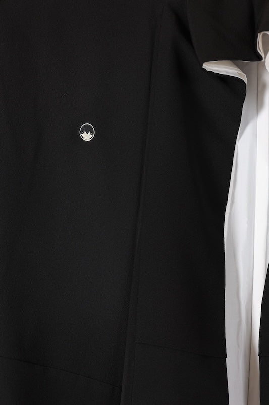 Black formal kimono used(Kurotomesode) with five crests of overlapping arrows in a circle, in shades of yellow-green, purple, indigo, coral, and white, depicting a seaside landscape, by a renowned artist, Kyoto Kaga Yuzen dyeing technique, L47