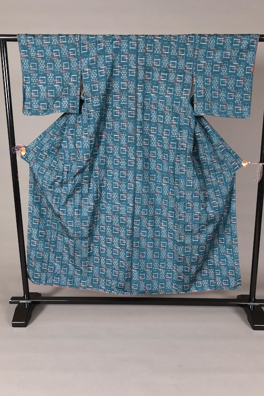 Yonezawa Tsumugi silk Japanese kimono, brand new, unused. Indigo, yellow, white, and coral-colored. Handwoven with geometric patterns. L136