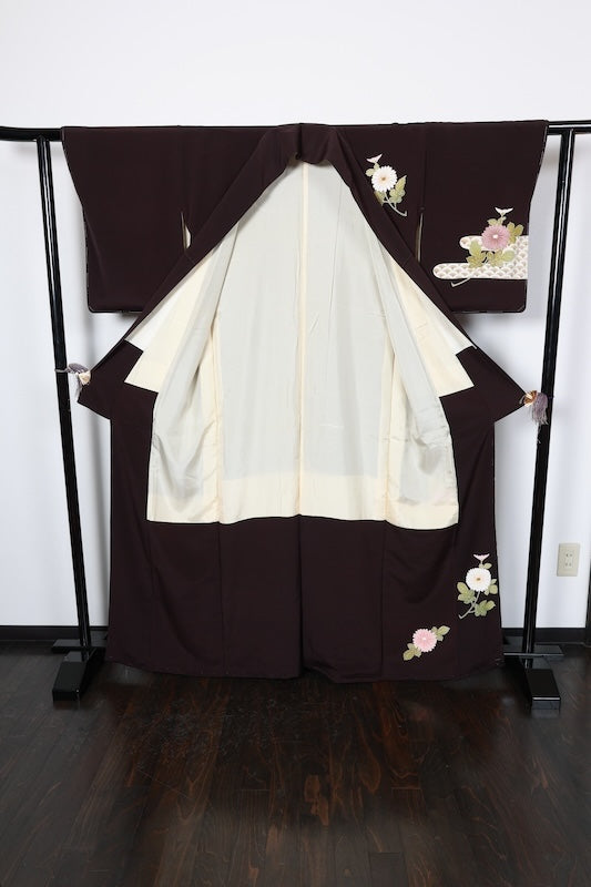 New, unused formal kimono (houmongi) in brown, green, beige, and white. Features gold thread embroidery, floral and wave patterns. (R72)