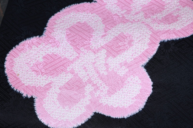 Nagoya obi (used sash), Arimatsu Shibori (tie-dyeing), black with cherry blossom pink accents, Hat Shibori (tie-dyeing), Hikida Shibori (tie-dyeing), Sayagata floral pattern throughout, R104