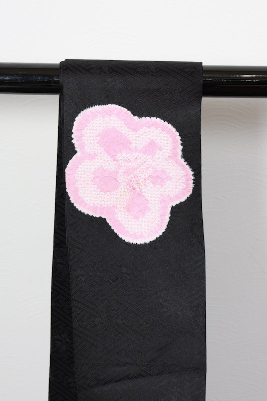 Nagoya obi (used sash), Arimatsu Shibori (tie-dyeing), black with cherry blossom pink accents, Hat Shibori (tie-dyeing), Hikida Shibori (tie-dyeing), Sayagata floral pattern throughout, R104