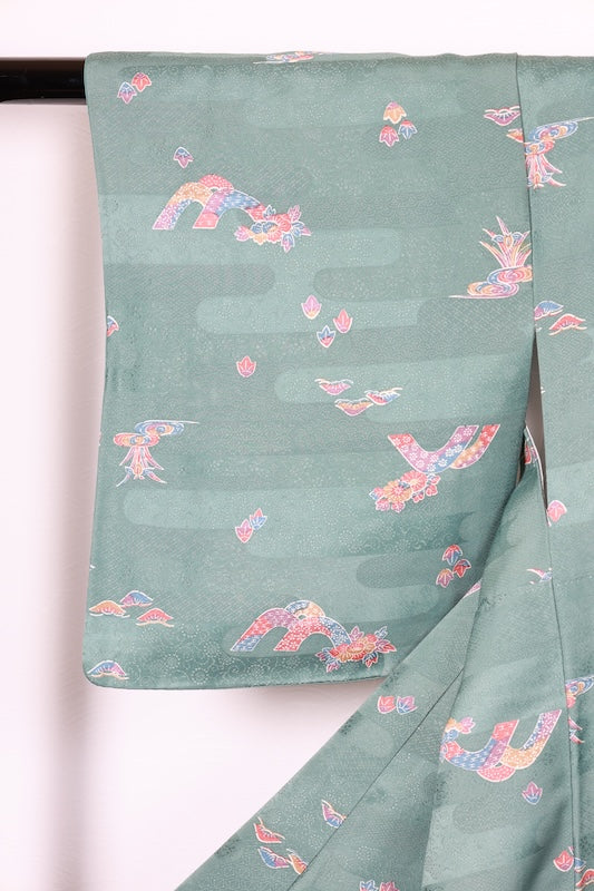 Japan used kimono fabric in light blue, brown, purple, indigo, and coral, with a floral pattern throughout. (R155)