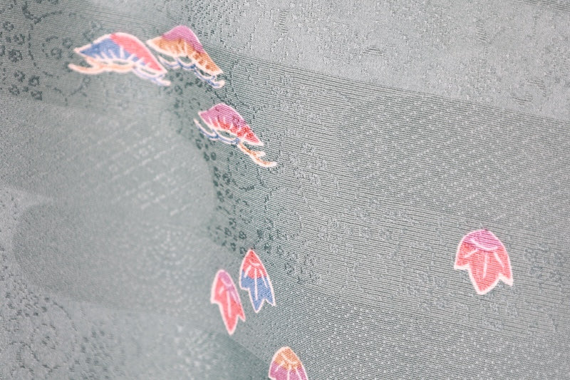 Japan used kimono fabric in light blue, brown, purple, indigo, and coral, with a floral pattern throughout. (R155)