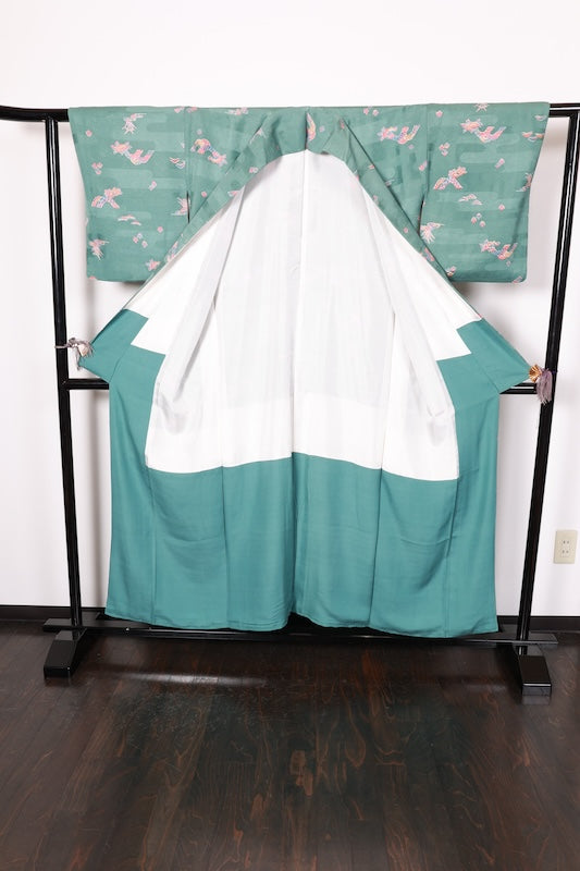 Japan used kimono fabric in light blue, brown, purple, indigo, and coral, with a floral pattern throughout. (R155)
