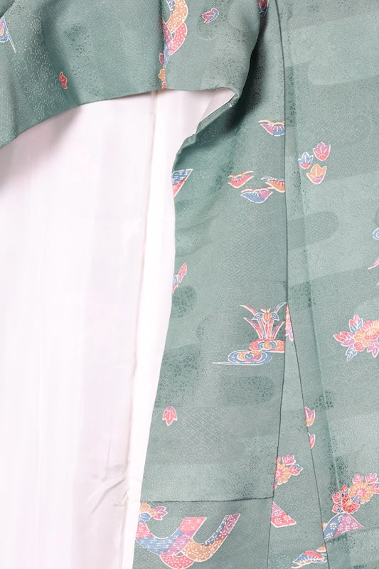 Japan used kimono fabric in light blue, brown, purple, indigo, and coral, with a floral pattern throughout. (R155)