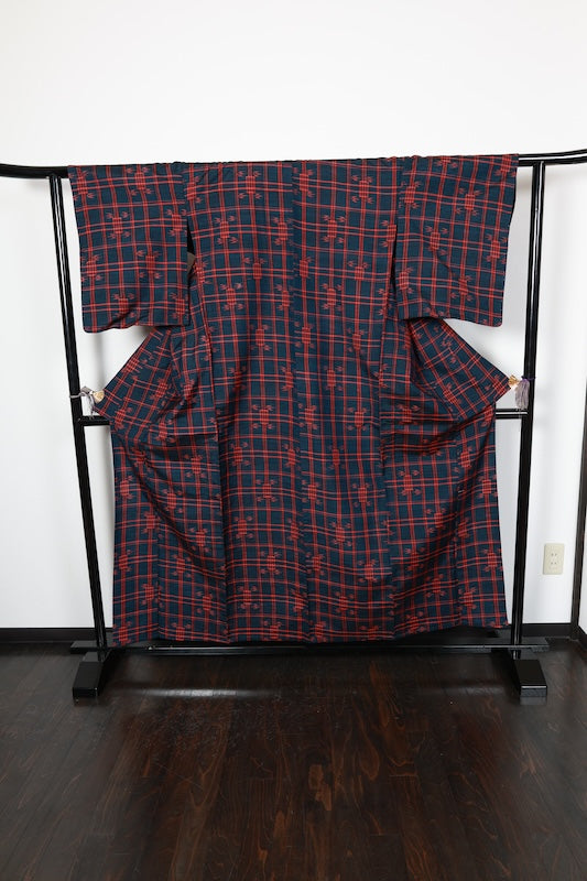 Yonezawa  Tsumugi (Japan  kimono) silk kimono, brand new, unused. Features indigo, orange, and coral colors, with a checkered pattern and swallow motif. (R198)