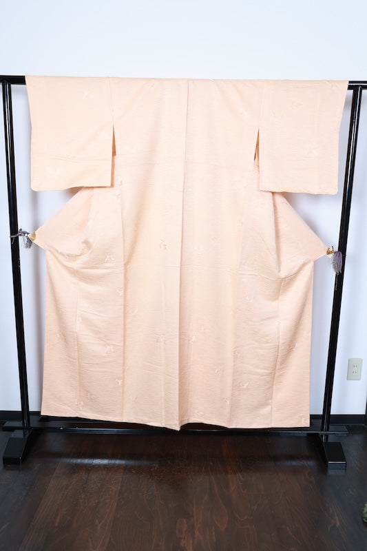 Japan  kimono, brand new, unused. Reddish-brown color with a continuous wave pattern, geometric design, embroidery, and a single butterfly crest (R256).