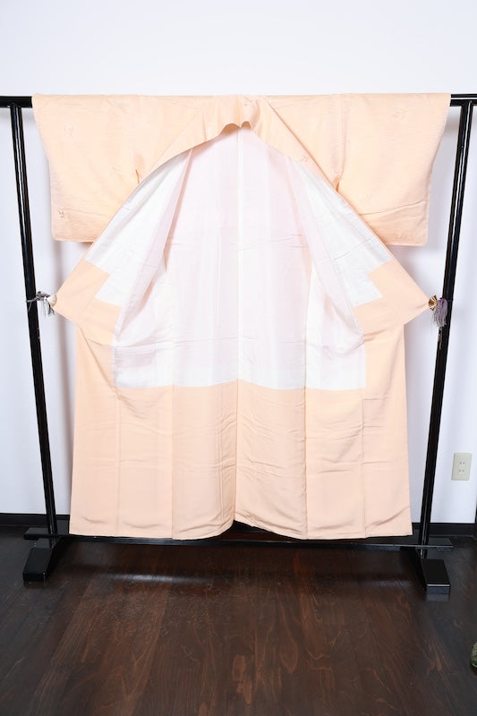 Japan  kimono, brand new, unused. Reddish-brown color with a continuous wave pattern, geometric design, embroidery, and a single butterfly crest (R256).