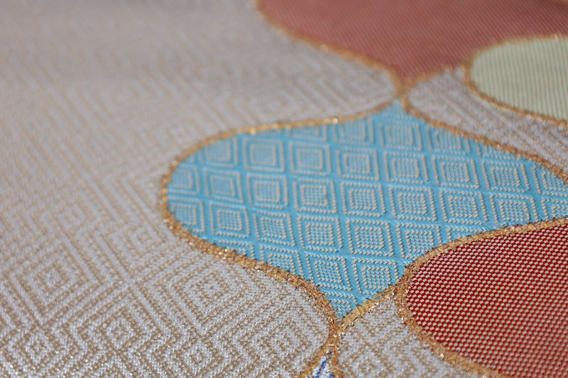 Nagoya obi (used sash) by Masuya Takao, gold, blue, light green, coral, rising wave pattern, pine needle diamond pattern, brocade weave, R225