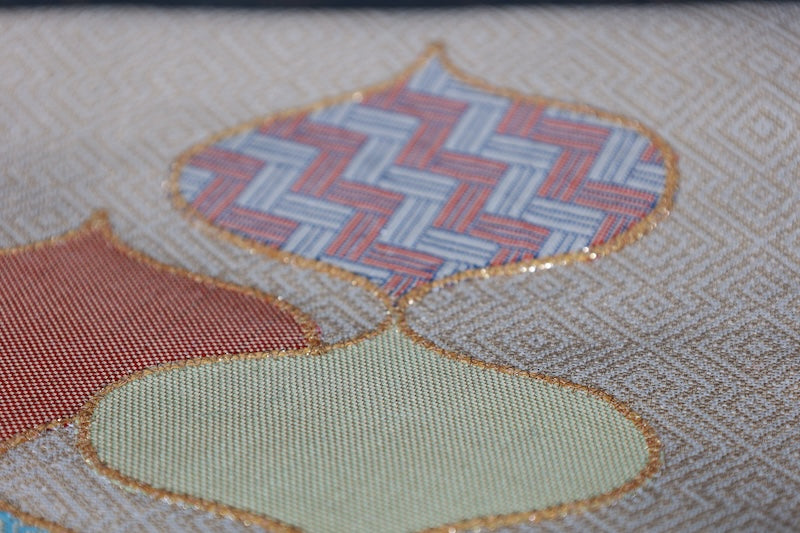 Nagoya obi (used sash) by Masuya Takao, gold, blue, light green, coral, rising wave pattern, pine needle diamond pattern, brocade weave, R225