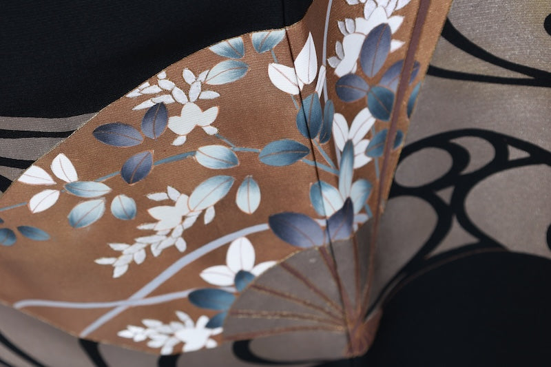 New, unused formal kimono (Tomesode). Black, gold, white, and gray. Rinpa style. Features include waves, fans, plum blossoms, chrysanthemums, grapes, maple leaves, and gold thread embroidery. Kyoto Yuzen dyeing. B1470