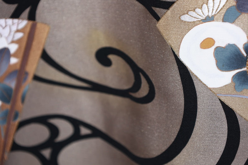 New, unused formal kimono (Tomesode). Black, gold, white, and gray. Rinpa style. Features include waves, fans, plum blossoms, chrysanthemums, grapes, maple leaves, and gold thread embroidery. Kyoto Yuzen dyeing. B1470