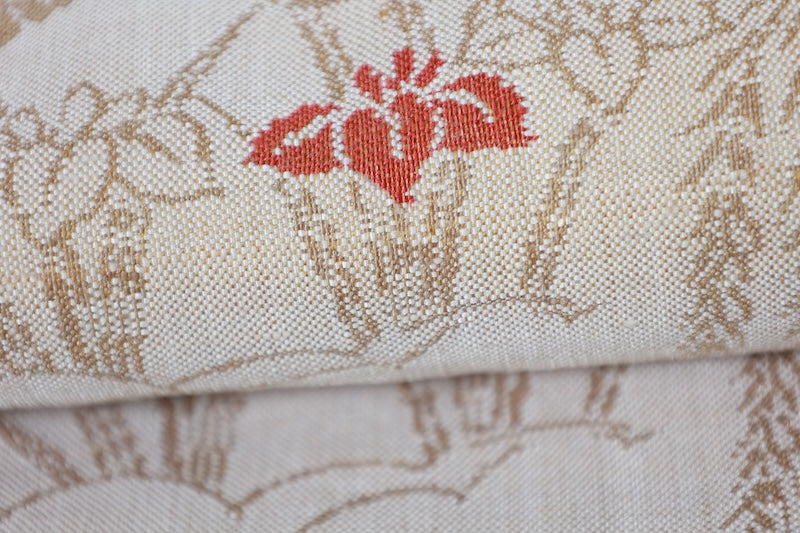 New, fukuro obi ( sash), made of silk floss, by Kawashima Textile, in beige, blue, brown, and red, featuring a floral and flowing water pattern (R220).