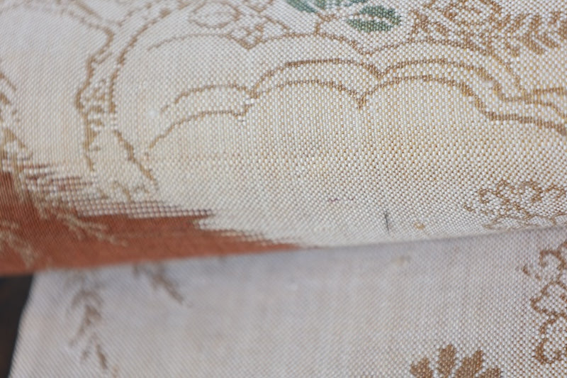 New, fukuro obi ( sash), made of silk floss, by Kawashima Textile, in beige, blue, brown, and red, featuring a floral and flowing water pattern (R220).