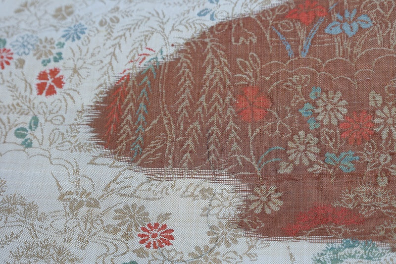 New, fukuro obi ( sash), made of silk floss, by Kawashima Textile, in beige, blue, brown, and red, featuring a floral and flowing water pattern (R220).