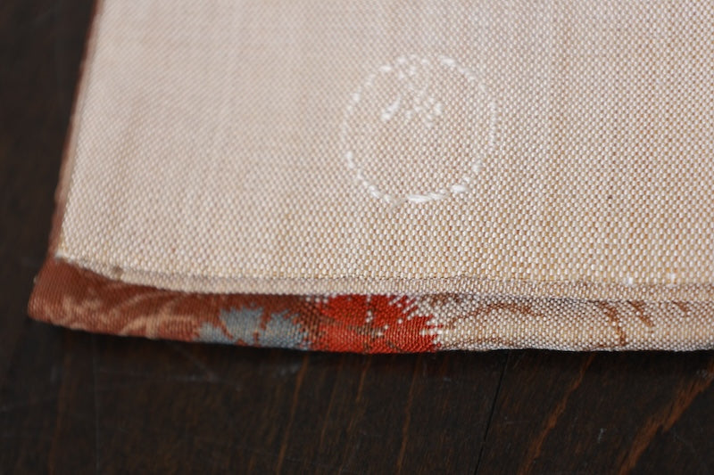 New, fukuro obi ( sash), made of silk floss, by Kawashima Textile, in beige, blue, brown, and red, featuring a floral and flowing water pattern (R220).