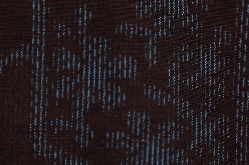 Ishige Yuki Tsumugi silk kimono, brand new and unused, in shades of indigo, with floral and geometric patterns.B1480