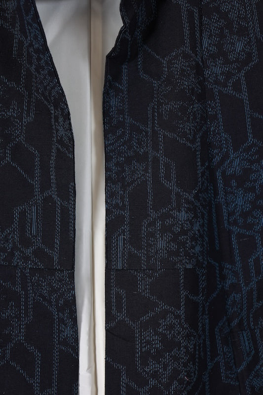 Ishige Yuki Tsumugi silk kimono, brand new and unused, in shades of indigo, with floral and geometric patterns.B1480