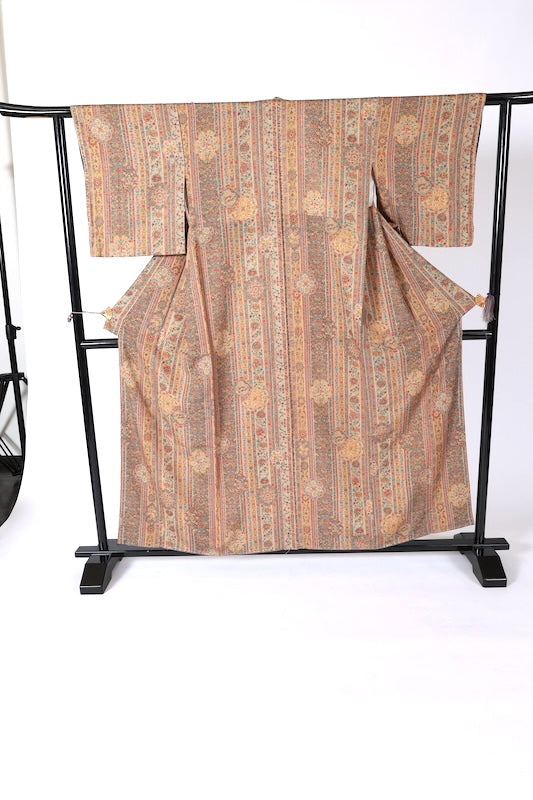 Komono (small patterned kimono), brand new, unused. Colors: ochre, coral, blue, purple. Features a sarasa (chintz) pattern and stripes. (J36)