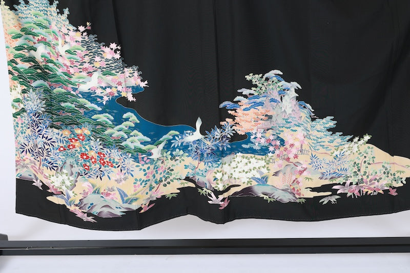 Black formal kimono　used (Kurotomesode) with five crests, a hollyhock on the right, indigo, shades of green, purple, gray, and ochre, featuring cranes and a landscape design, Kyoto Kaga Yuzen dyeing, L44