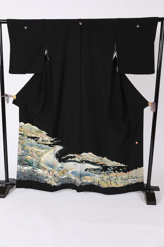 Black formal kimono used(Kurotomesode) with five crests of overlapping arrows in a circle, in shades of yellow-green, purple, indigo, coral, and white, depicting a seaside landscape, by a renowned artist, Kyoto Kaga Yuzen dyeing technique, L47