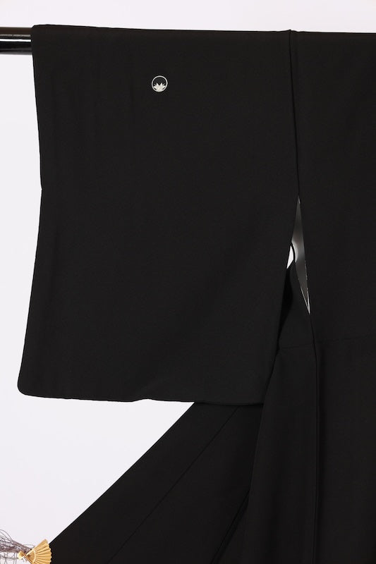 Black formal kimono used(Kurotomesode) with five crests of overlapping arrows in a circle, in shades of yellow-green, purple, indigo, coral, and white, depicting a seaside landscape, by a renowned artist, Kyoto Kaga Yuzen dyeing technique, L47