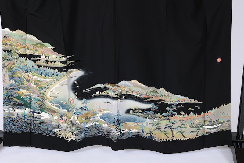 Black formal kimono used(Kurotomesode) with five crests of overlapping arrows in a circle, in shades of yellow-green, purple, indigo, coral, and white, depicting a seaside landscape, by a renowned artist, Kyoto Kaga Yuzen dyeing technique, L47
