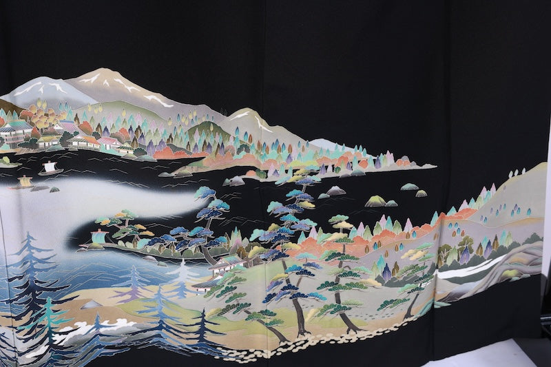 Black formal kimono used(Kurotomesode) with five crests of overlapping arrows in a circle, in shades of yellow-green, purple, indigo, coral, and white, depicting a seaside landscape, by a renowned artist, Kyoto Kaga Yuzen dyeing technique, L47