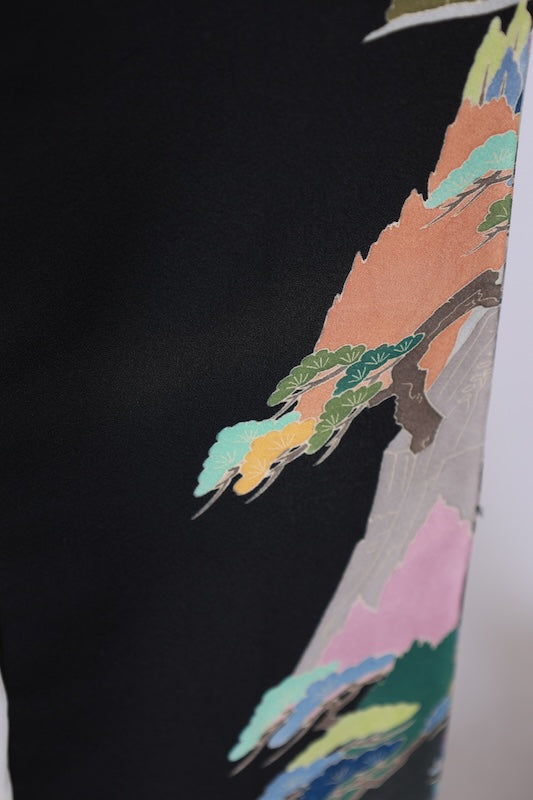 Black formal kimono used(Kurotomesode) with five crests of overlapping arrows in a circle, in shades of yellow-green, purple, indigo, coral, and white, depicting a seaside landscape, by a renowned artist, Kyoto Kaga Yuzen dyeing technique, L47
