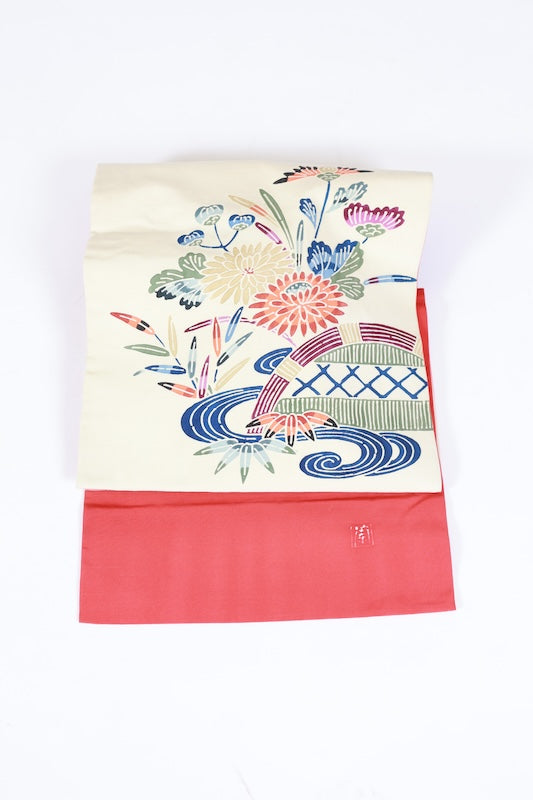 Nagoya obi used (sash), Bingata style, by a renowned artist, in off-white, indigo, green, brown, gray, blue, featuring floral, wave, and bamboo fence motifs, hand-dyed, stencil-dyed, L77