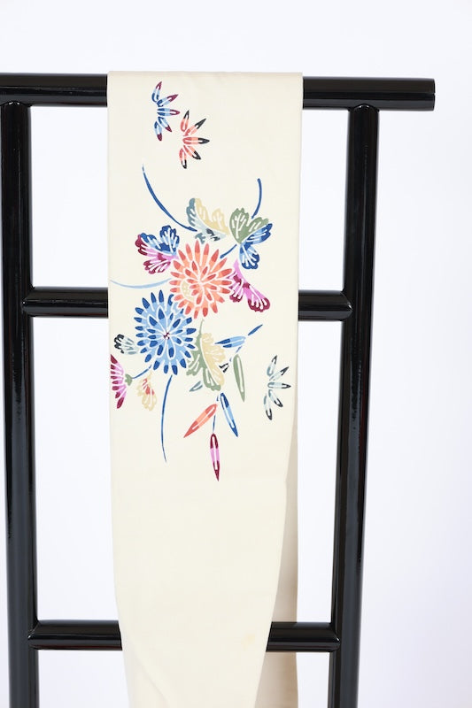 Nagoya obi used (sash), Bingata style, by a renowned artist, in off-white, indigo, green, brown, gray, blue, featuring floral, wave, and bamboo fence motifs, hand-dyed, stencil-dyed, L77