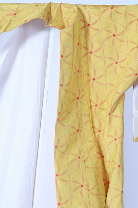 Japanese kimono used Tsumugi silk fabric, yellow, red, brown, ikat pattern, pinwheel design, handwoven, L110