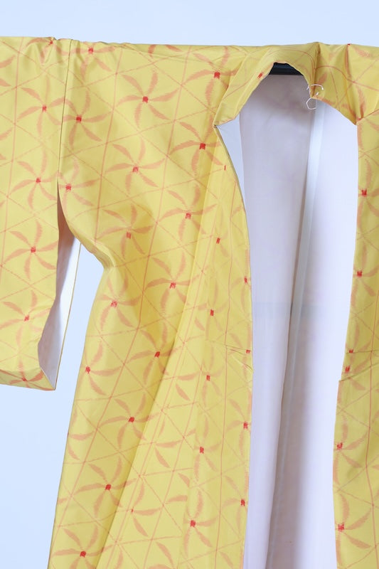Japanese kimono used Tsumugi silk fabric, yellow, red, brown, ikat pattern, pinwheel design, handwoven, L110