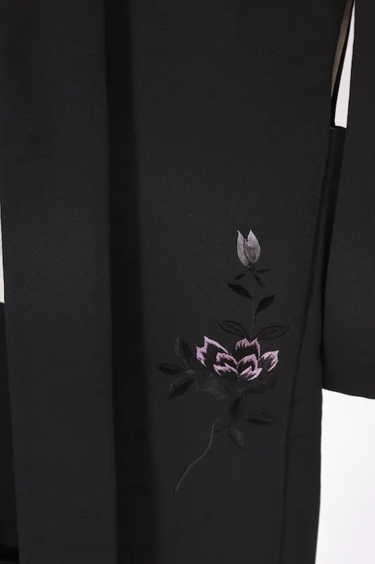 Black used Haori jacket, pink rose embroidery, gold "Maruni Umebachi" (circled plum blossom) stitched crest, includes haori cords (Q15).