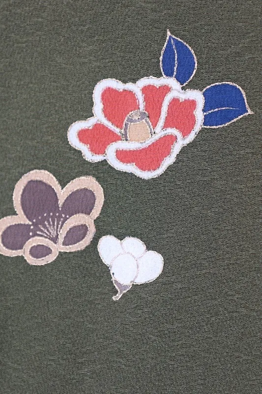 New, unused formal kimono (houmongi) in green, purple, white, red, blue, and gold, featuring camellia and cherry blossom patterns. (G10)