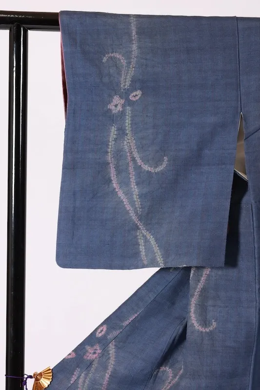 Tsumugi (Japan kimono) indigo and cherry-blossom pink; *nuitori-shibori* (stitched resist-dyeing) and *boshi-shibori* (capped resist-dyeing); abstract pattern; K327.