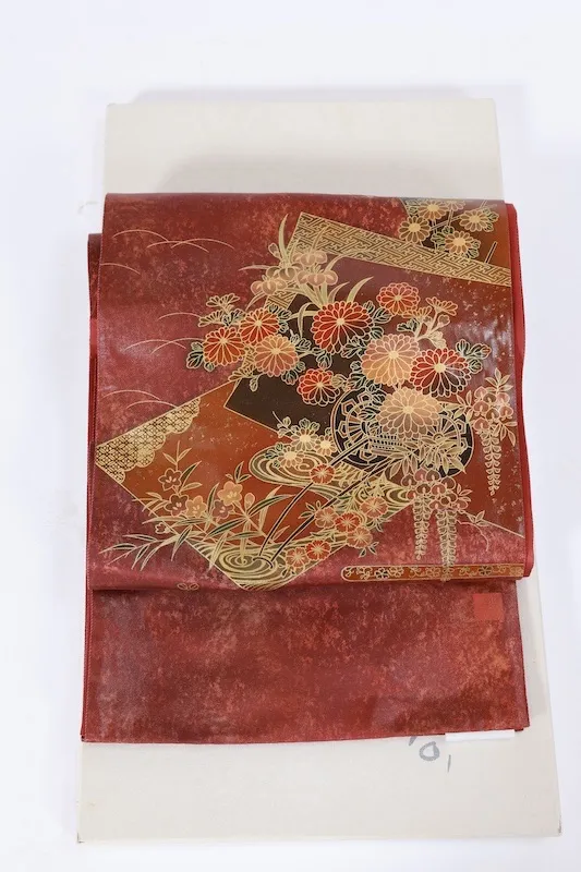 Fukuro obi　used (formal sash), lacquer and gold leaf, plum blossoms, chrysanthemums, cherry blossoms, seigaiha (wave pattern), flower cart, rust-red, tataki (stamped) finish, taiko (drum-shaped) pattern, P