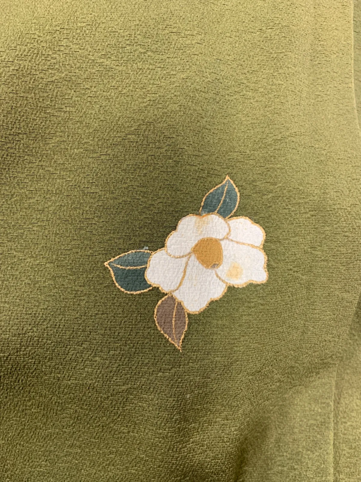 New, unused formal kimono (houmongi) in green, purple, white, red, blue, and gold, featuring camellia and cherry blossom patterns. (G10)