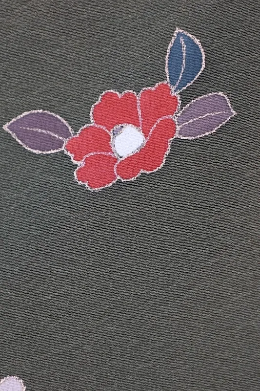 New, unused formal kimono (houmongi) in green, purple, white, red, blue, and gold, featuring camellia and cherry blossom patterns. (G10)
