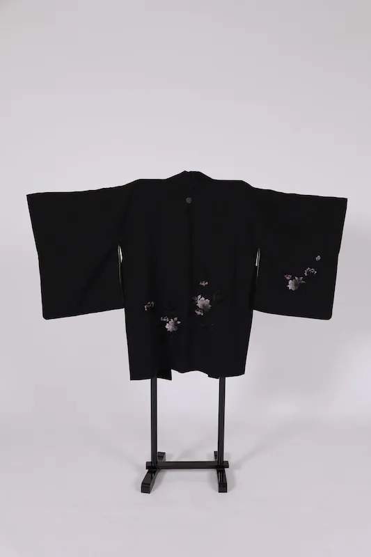 Black used Haori jacket, pink rose embroidery, gold "Maruni Umebachi" (circled plum blossom) stitched crest, includes haori cords (Q15).