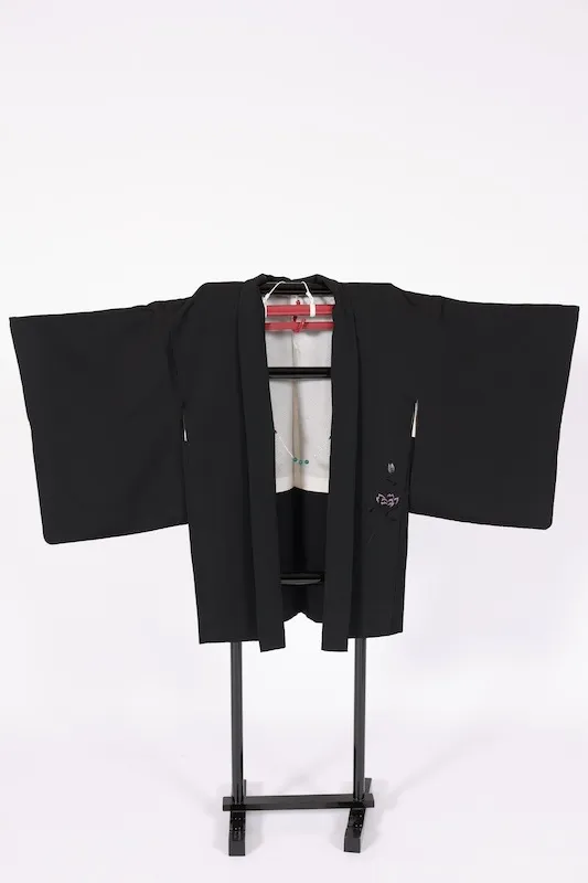 Black used Haori jacket, pink rose embroidery, gold "Maruni Umebachi" (circled plum blossom) stitched crest, includes haori cords (Q15).