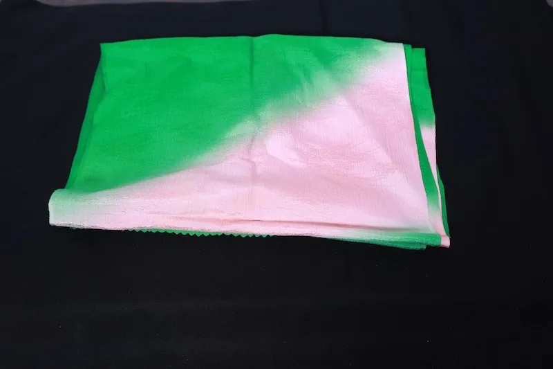 used Stole: Cherry-blossom pink, green, gold, and silver; featuring a crane motif and an all-over woven pattern (R348).