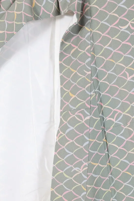 Japan used kimono fabric in green, purple, mustard yellow, gray, and coral yellow with an abstract pattern. B1468