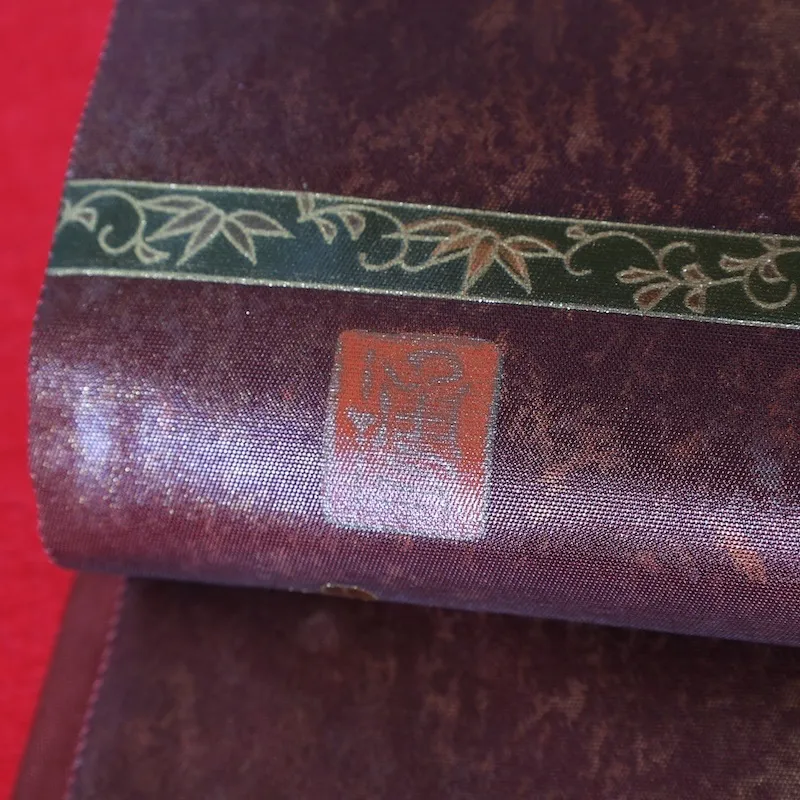 Fukuro obi　used (formal sash), lacquer and gold leaf, plum blossoms, chrysanthemums, cherry blossoms, seigaiha (wave pattern), flower cart, rust-red, tataki (stamped) finish, taiko (drum-shaped) pattern, P